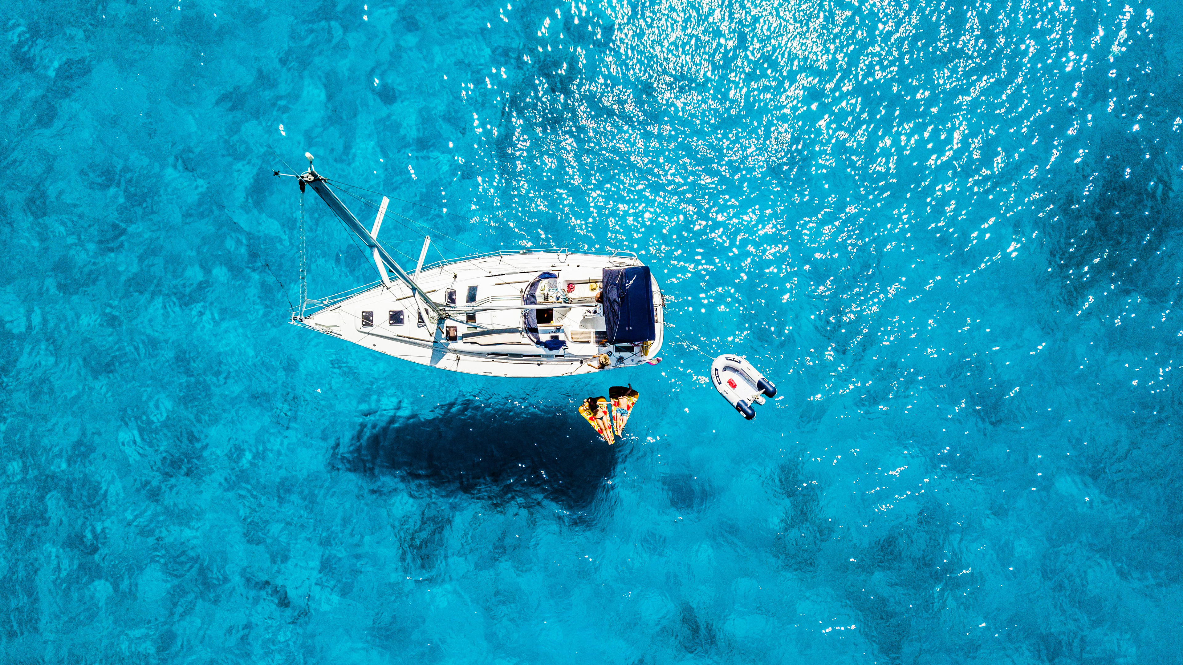 Boat On Blue Sea 4K Wallpaper (1)